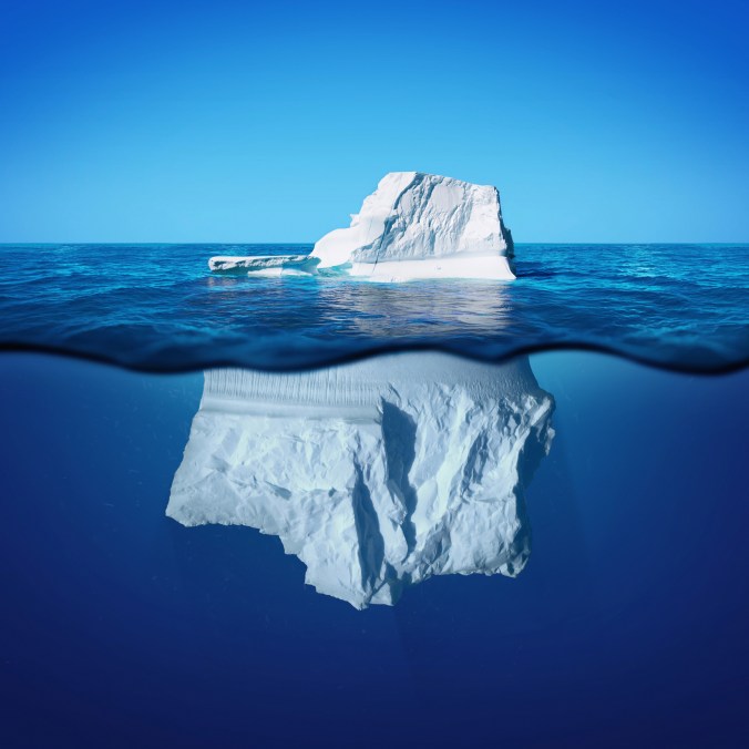 Underwater photo view of iceberg with beautiful transparent sea on background